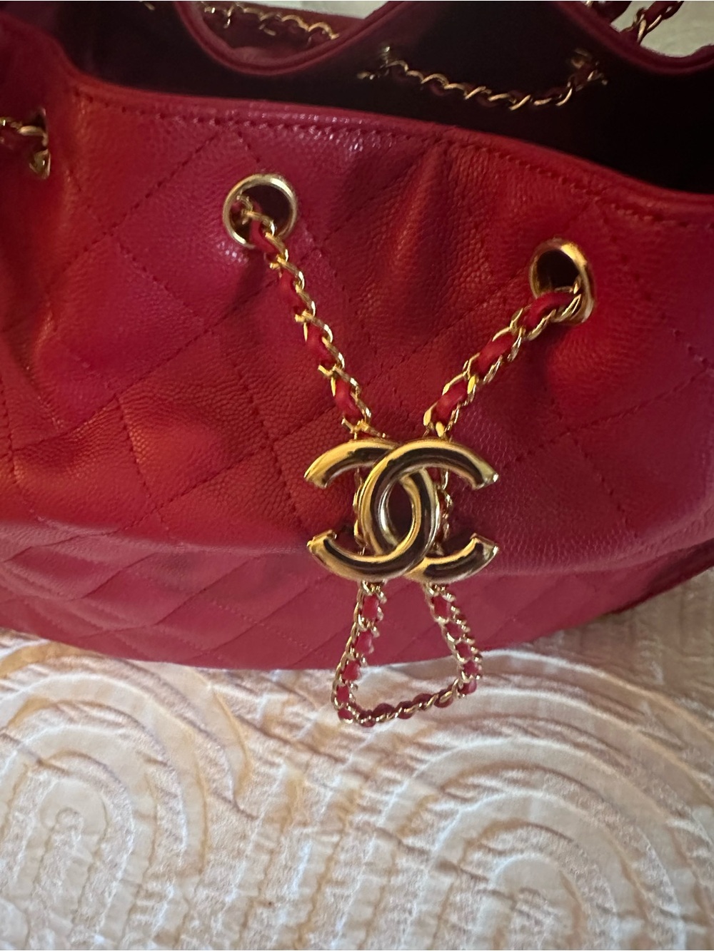 CHANEL Quilted Red Shoulder Drawstring Bag with Gold CC Charm